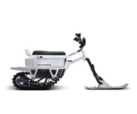 White Moonbike electric snow bike in a studio product view.