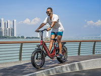 Heybike Ranger 3.0 Pro folding fat-tire electric bike with 750W rated rear-hub motor, KENDA 20 by 4 inch fat tires with puncture protection, hydraulic disc brakes, Shimano Altus 8-speed gearing, hydroformed aluminum folding frame, hydraulic front suspension, TFT color display, NFC Tap & Go unlocking, integrated turn signals, available in Ruby Red, Sapphire Blue, or Emerald Green