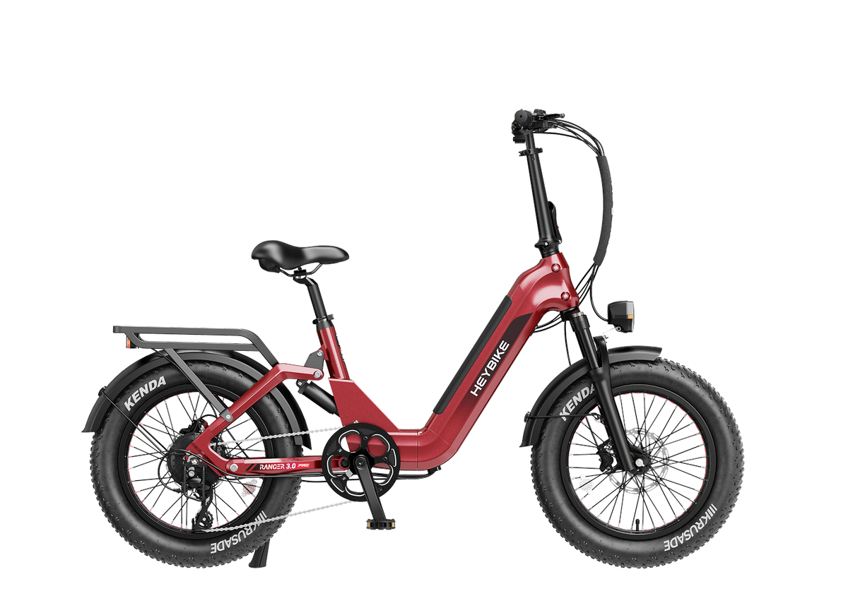 Heybike Ranger 3.0 Pro folding fat-tire electric bike with 750W rated rear-hub motor, KENDA 20 by 4 inch fat tires with puncture protection, hydraulic disc brakes, Shimano Altus 8-speed gearing, hydroformed aluminum folding frame, hydraulic front suspension, TFT color display, NFC Tap & Go unlocking, integrated turn signals, available in Ruby Red, Sapphire Blue, or Emerald Green