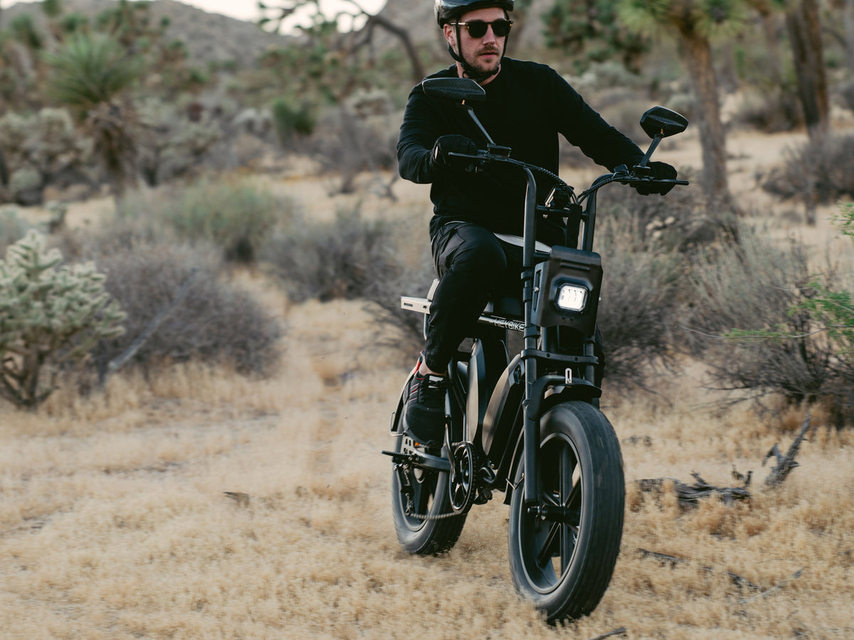 Heybike Saturn moped-style commuter e-bike: 52V 1000W continuous / 1800W peak hub motor, 95 Nm torque, single or dual-battery configuration, hydraulic disc brakes, full suspension with 140 mm front travel, turn signals, TFT color display, UL 2849 certified