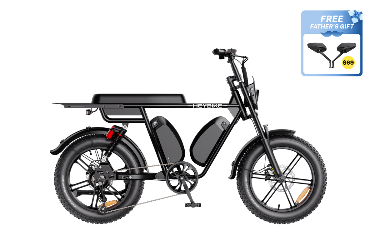 Heybike Saturn moped-style commuter e-bike: 52V 1000W continuous / 1800W peak hub motor, 95 Nm torque, single or dual-battery configuration, hydraulic disc brakes, full suspension with 140 mm front travel, turn signals, TFT color display, UL 2849 certified