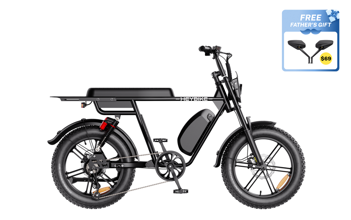 Heybike Saturn moped-style commuter e-bike: 52V 1000W continuous / 1800W peak hub motor, 95 Nm torque, single or dual-battery configuration, hydraulic disc brakes, full suspension with 140 mm front travel, turn signals, TFT color display, UL 2849 certified