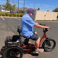 Rider seated on the VTUVIA E-COZY with rear cargo basket