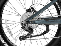 Dark Blue Brawny XM battery pack shown removed from the frame beside the front fork