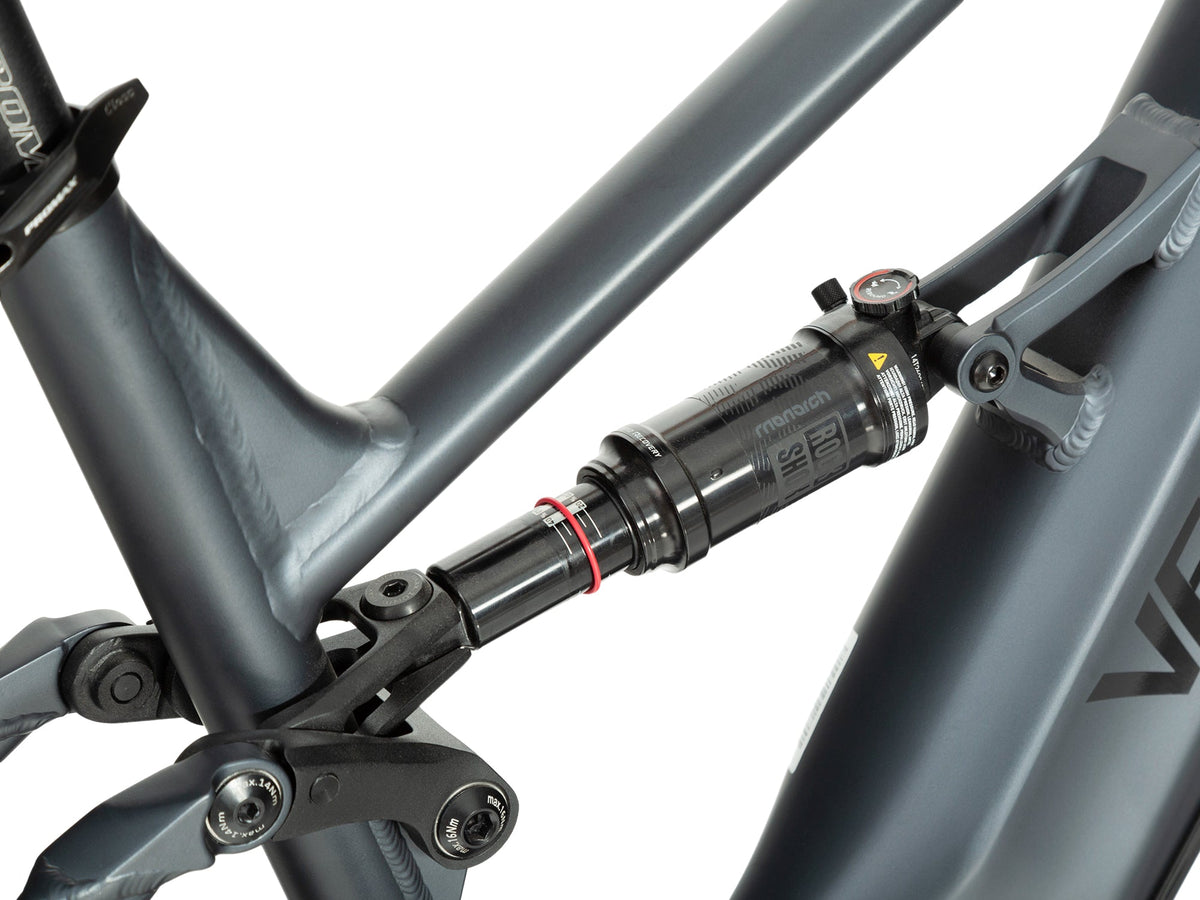 Close view of Dark Blue Brawny XM RockShox rear shock and suspension linkage