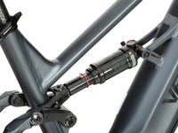 Close view of Dark Blue Brawny XM RockShox rear shock and suspension linkage