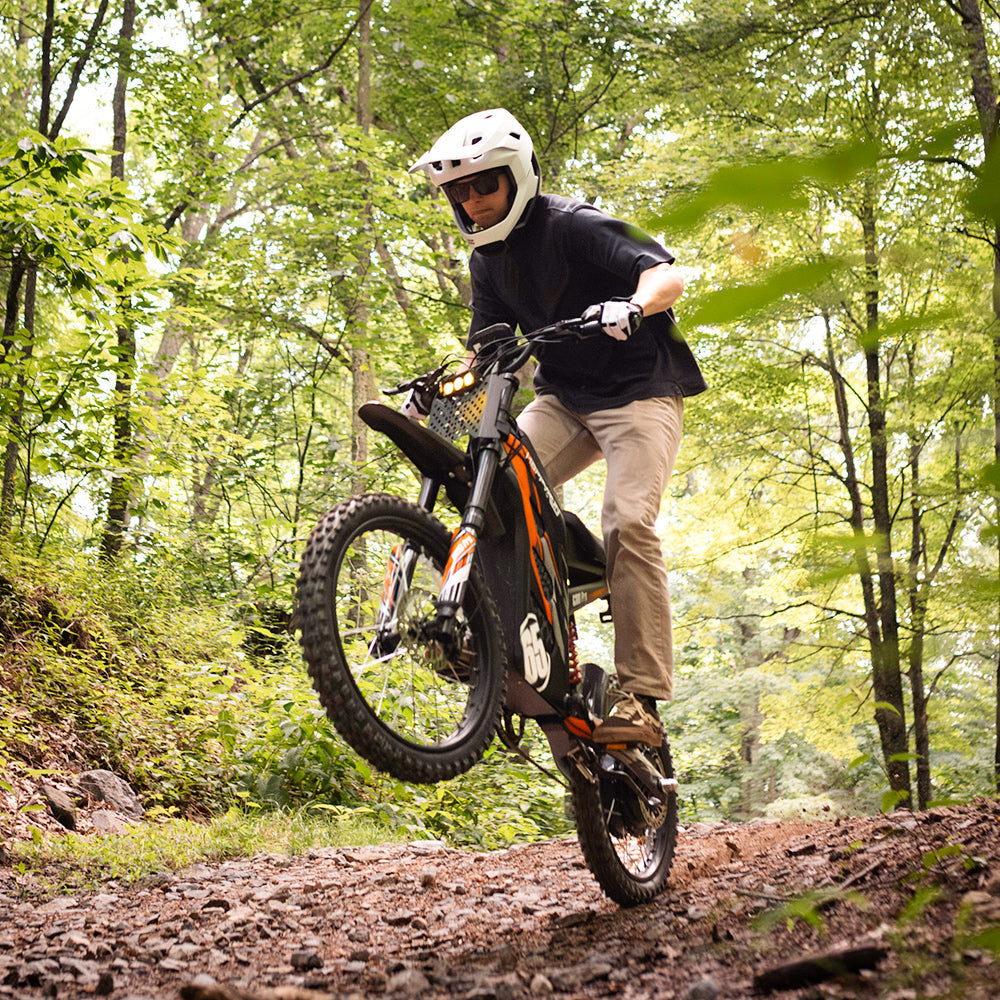 HappyRun G300 Pro 6500W peak motocross-format electric dirt bike: 50 mph top speed, 72V 30Ah battery, hydraulic 180/203mm disc brakes, inverted front fork, carbon steel frame, motocross-format tires, IPX5, off-road use only