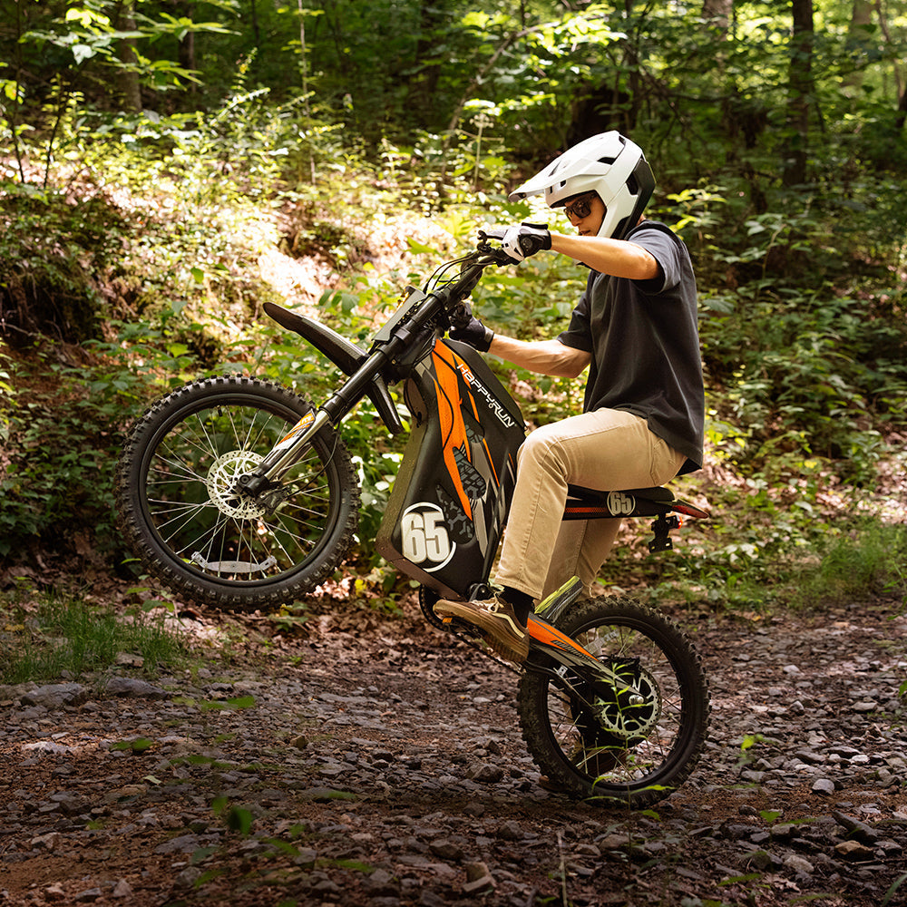 HappyRun G300 Pro 6500W peak motocross-format electric dirt bike: 50 mph top speed, 72V 30Ah battery, hydraulic 180/203mm disc brakes, inverted front fork, carbon steel frame, motocross-format tires, IPX5, off-road use only