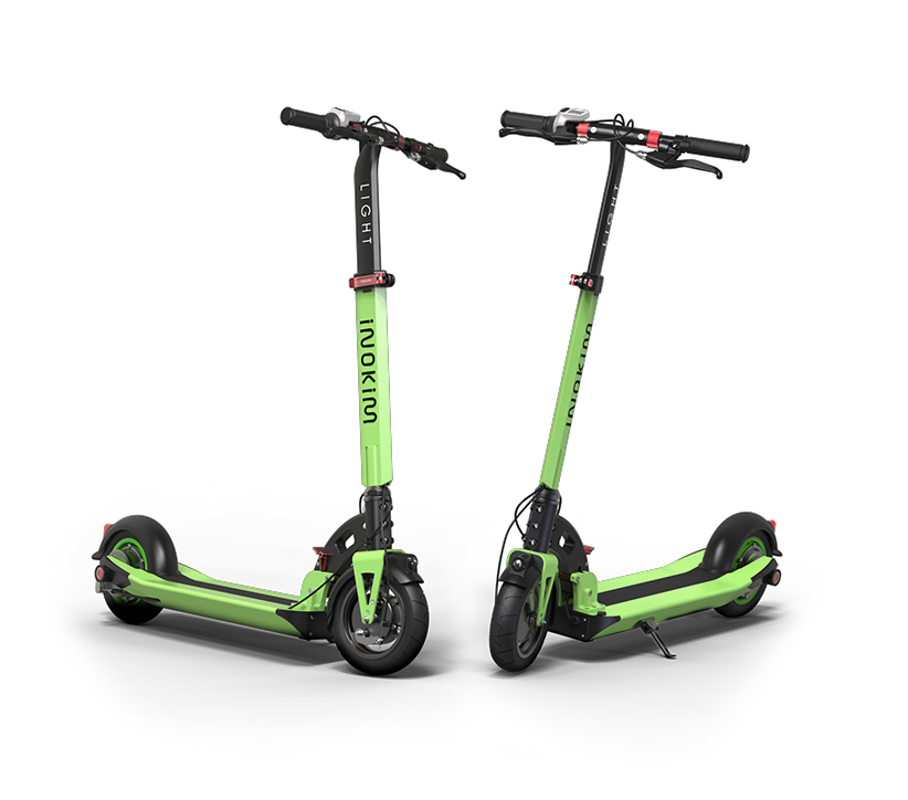 Green INOKIM Light 2 Super electric scooter with 8.5 inch pneumatic tires and a lightweight folding frame.