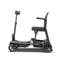 ScootNGo Lite black folding mobility scooter, left side view with red rear reflector