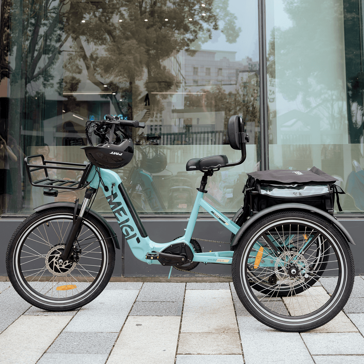 Blue MG2302-SILVERADO electric tricycle parked outside a storefront