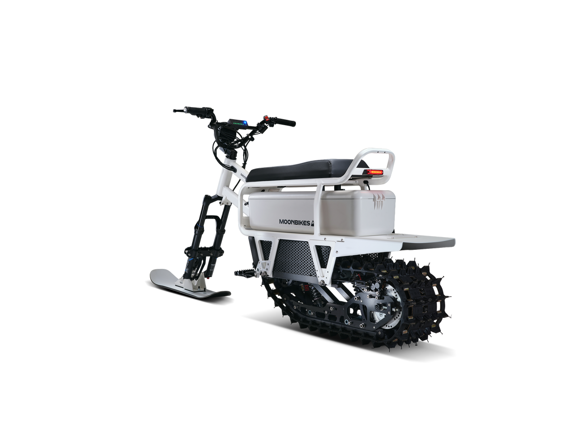 White Moonbike electric snow bike in a front three-quarter view.