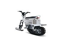 White Moonbike electric snow bike in a front three-quarter view.