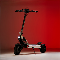 Landturbo Ultra with front headlight on against a red studio backdrop, showing the tall handlebar and off-road tire stance.