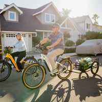 White VTUVIA Zeal XT8 shown with rack and fenders in a group street scene