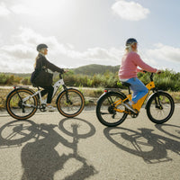 White VTUVIA Zeal XT8 step-through bike with rider outdoors