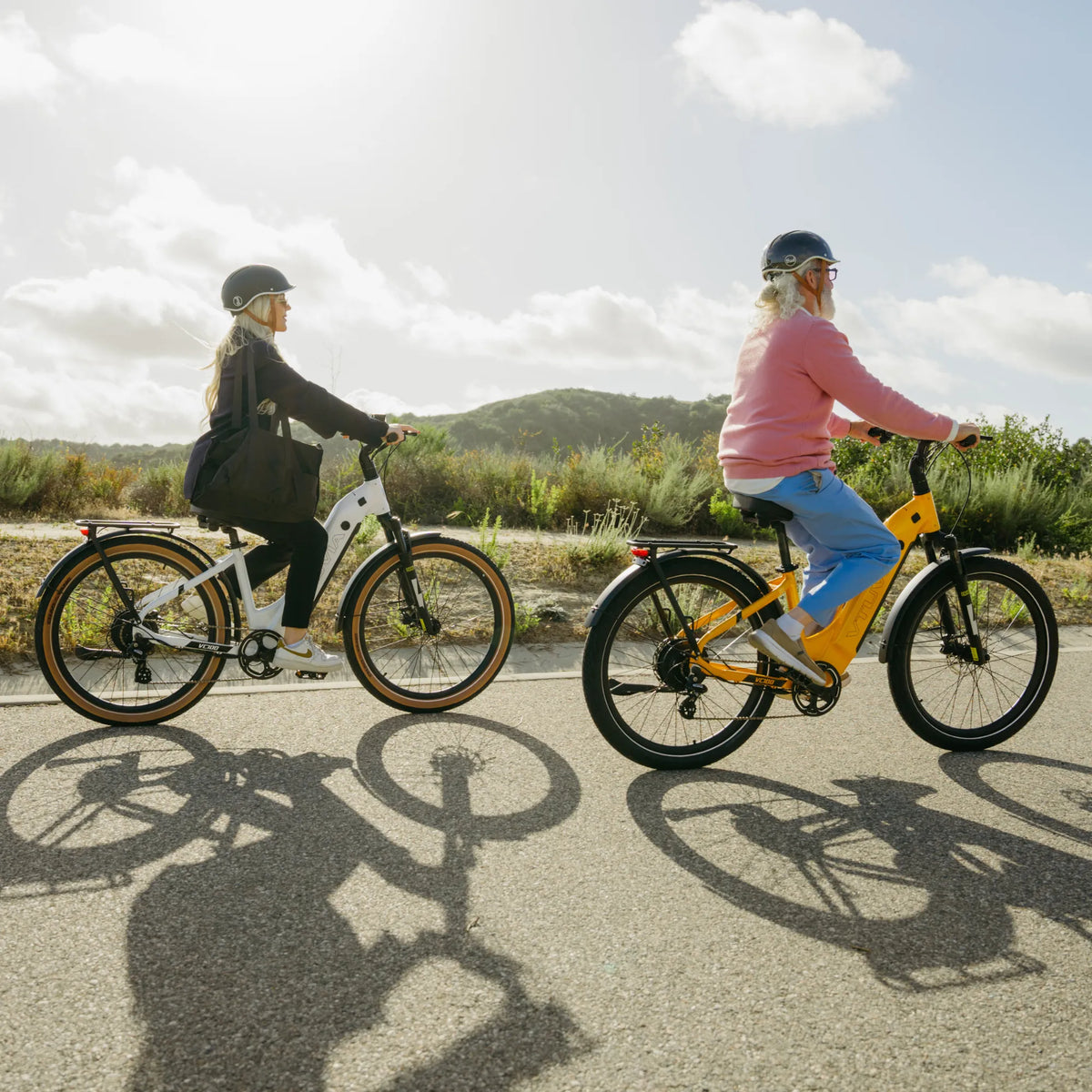 White VTUVIA Zeal XT8 step-through bike with rider outdoors