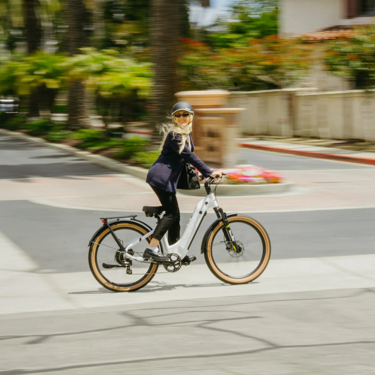 Rider on white VTUVIA Zeal XT8 step-through e-bike in a city setting